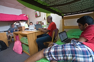 Students lounge in their residence hall room.